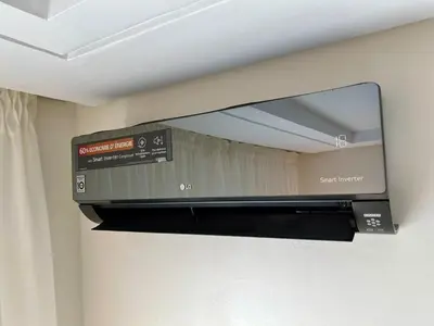 a flat screen tv on a wall in a room at Casablanca Central Suites - Casa Voyageurs in Casablanca