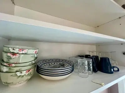 a shelf with some plates and bowls on it at Casablanca Central Suites - Casa Voyageurs in Casablanca