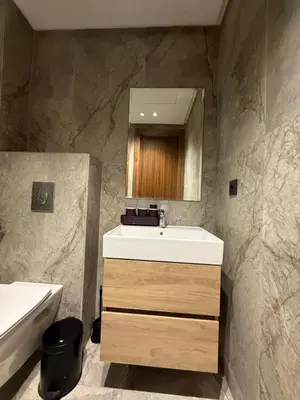 a bathroom with a sink and a mirror at Appartement maarif in Casablanca