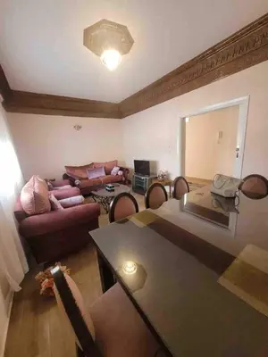 a living room with a couch and a table at Cozy Condo in Rabat in Rabat