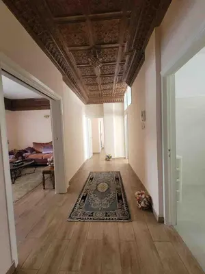 an empty room with a ceiling and a rug at Cozy Condo in Rabat in Rabat