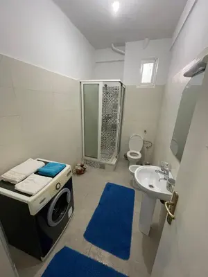 a bathroom with a sink and a shower and a toilet at Cozy Condo in Rabat in Rabat