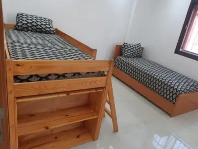 two bunk beds in a room with at Appartement 3 chambres et Salon sans ascenseur 3 mn à pied au Parc du Mohammedia in Mohammedia