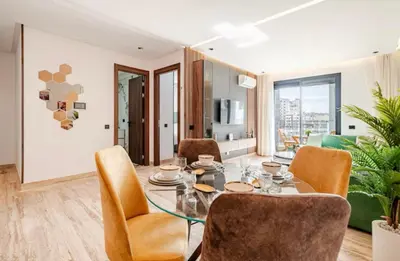 a dining room with a table and chairs at Studio vert chic au cœur de Casablanca in Casablanca