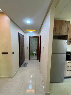 a hallway of a house with a kitchen and a bathroom at apartment in sidi rahal in Sidi Rahal
