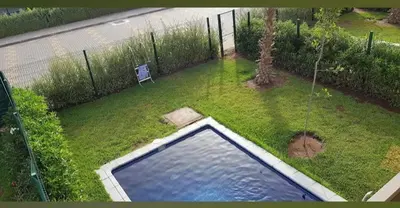 an aerial view of a swimming pool in a yard at Dokkali