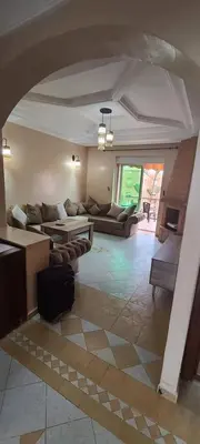 a large living room with couches and a table at 2 bedrooms apt Ricoflores Mimosa in Mohammedia