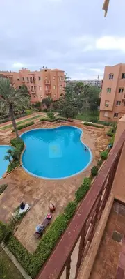an overhead view of a swimming pool in a city at 2 bedrooms apt Ricoflores Mimosa in Mohammedia