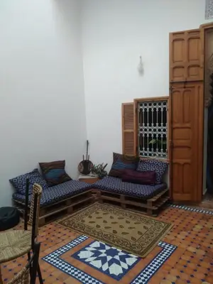 a living room with two couches and a rug at Studio with Swimmingpool in Harhoura in Temara