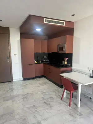 a kitchen with a white table and a white table at Charming Studio in Oasis in Oulad Akkou