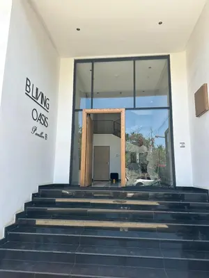 an entrance to a building with a glass door at Charming Studio in Oasis in Oulad Akkou