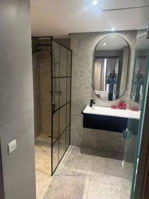 a bathroom with a sink and a mirror at Charming Studio in Oasis in Oulad Akkou