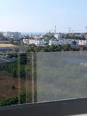 a glass window with a view of a city at اجمل شقة in Temara