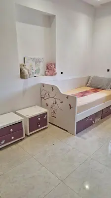 a bedroom with a bed and two drawers at Exclusive Luxury Suite in Rabat City Center in Rabat