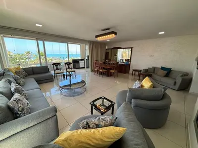 a large living room with couches and a table at Luxury Sea View in Tamaris