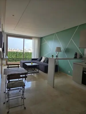 a living room with a couch and a table at Le CasaStud' in Casablanca