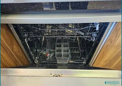 an oven with its door open with its racks at Le Refuge Océanique idéal ! in O Ben Slimane