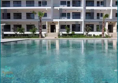 a swimming pool in front of a building at Le Refuge Océanique idéal ! in O Ben Slimane