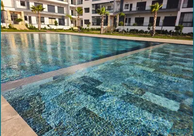 a large swimming pool in front of a building at Le Refuge Océanique idéal ! in O Ben Slimane