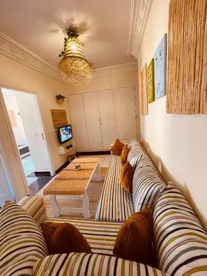 a living room with a couch and a table at Pleasant Studio in Casablanca in Casablanca