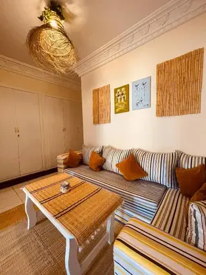 a living room with a couch and a table at Pleasant Studio in Casablanca in Casablanca