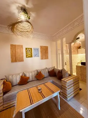 a living room with a couch and a coffee table at Pleasant Studio in Casablanca in Casablanca