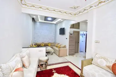 a living room with a couch and a tv at Appartement Authentique & Moderne au Cœur de la Médina in Casablanca