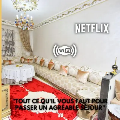 a living room with a couch and a table at Appartement Authentique & Moderne au Cœur de la Médina in Casablanca