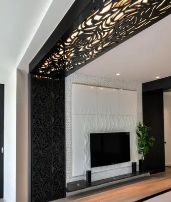 a living room with a flat screen tv on a wall at Luxury Villa with pool 6 min to Football Stadium CAF in Rabat