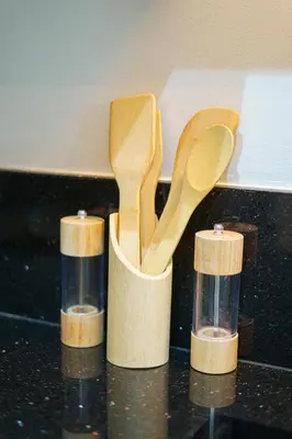 two wooden spoons in a cup on a counter at Central and Chic Apartment in the Heart of Casablanca Near To Station Tramway Abdelmoumen in Casablanca