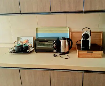 a kitchen counter with a toaster and a microwave at Chez Basma in Rabat