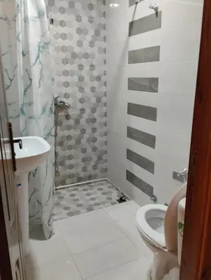 a bathroom with a shower and a toilet and a sink at Settat, Morocco in Settat