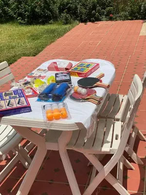 a white picnic table with food on it at Farm - Private pool - Games - Nature in El Jadida