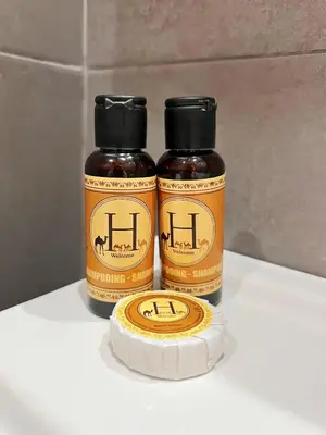 two bottles of honey sitting on top of a counter at Elegant & Spacious Apartment in Prestigia in Rabat