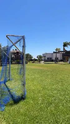 a net in the middle of a field at Farm with villa and pool in Settat