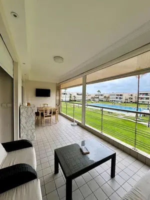 a large living room with a view of the ocean at OlaBlanca2, appartement avec terrasse et vue sur piscine in Sidi Rahal