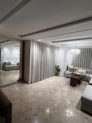 a living room with a couch and a table at Appartement de luxe avec parking gratuit à Casablanca, Vue & Confort in Aïn Sebaa