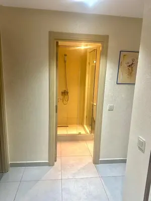 a bathroom with a shower and a walk in shower at Residence Bleu Dhalia in Sidi Rahal