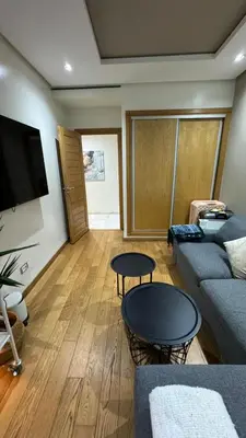 a living room with a couch and a table at Jnane californie in Casablanca