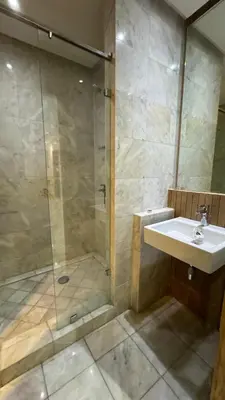 a bathroom with a sink and a shower at Jnane californie in Casablanca