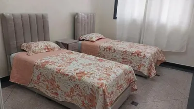 a room with two beds and a window at Appartement Meublé avec Parking Gratuit, Calme & Pratique à Casablanca in Aïn Sebaa