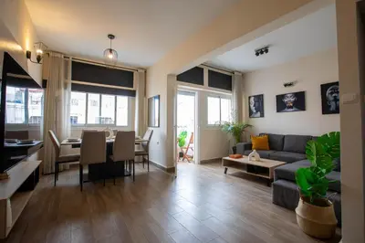 a living room with a couch and a table at Duplex au centre de Rabat in Rabat