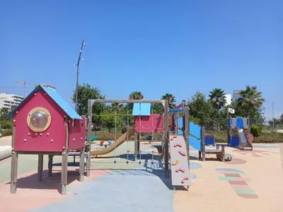 a park with a playground with a slide at Très beau studio Océan Park in Aïn Harrouda