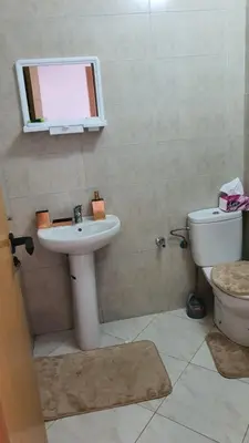 a bathroom with a sink and a toilet at Ocean View Tamaris in Tamaris