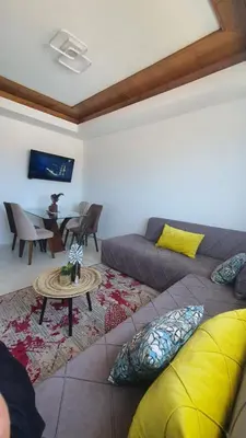 a living room with a couch and a table at Ocean View Tamaris in Tamaris