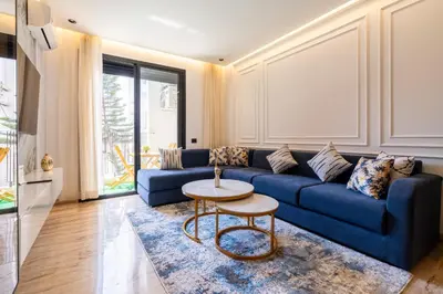 a living room with a blue couch and a table at Chic blue studio au cœur deCasablanca in Casablanca