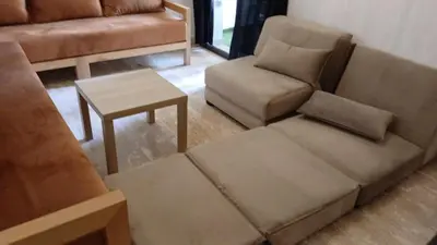 a living room with a couch and a coffee table at Macha allah in Bouznika