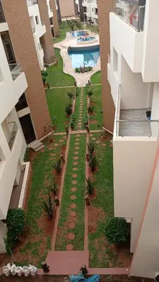 an aerial view of a courtyard of a building with a swimming pool at Macha allah in Bouznika