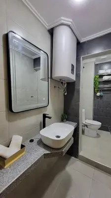 a bathroom with a sink and a toilet at Studio Marzouga in Deroua