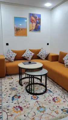 a living room with a couch and a table at Studio Marzouga in Deroua